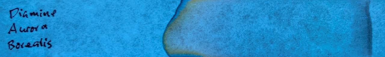 Photo of chromatography paper under UV light.