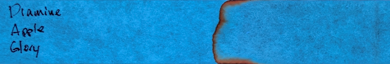 Photo of chromatography paper under UV light.