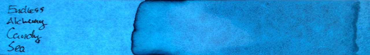 Photo of chromatography paper under UV light.