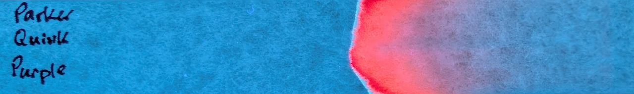 Photo of chromatography paper under UV light.