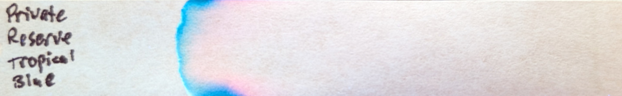 Photo of chromatography paper under UV light.