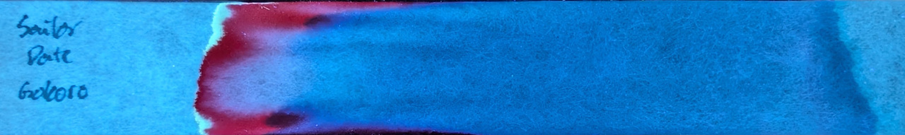 Photo of chromatography paper under UV light.