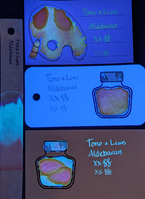 Photo of 3 ink swatches & chromatography strip for Tono + Lims Star Light Series: Aldebaran which is a coral colored ink with multi-shading/chromashading to pink and orange.  Each swatch contains the ink name followed by "XX" 2 curlicues in both stub and EF widths.  Swatch 1: Iroful swatch card with an outline of a paint palette and tube. The palette is mostly filled in with swirls of ink and a couple areas that are more pink but outlined in closer to orange. There is an outline of a paint tube which is swabbed and looks coral. The writing is coral and somewhat light but easily legible.  Swatch 2: Col-o-ring swatch card with a stamped outline of an ink bottle. The outlined area is mostly full of an ink blob which is a gradient going from a coral outline to more pink in the upper left and orangeish in the lower right. Swab across "cap" is more pink. The writing sample is pink and very light.  Swatch 3: MD swatch card with a stamped outline of an ink bottle. The outlined area is mostly full of an ink blob which is coral on the upper right and lower left, but mostly a large area divided in two, outlined in orange but filled in with pink/magenta. Swab across "cap" is {describe cap}. Text is coral.  Chromatography is barely visible but looks pinkish and quickly fades.
