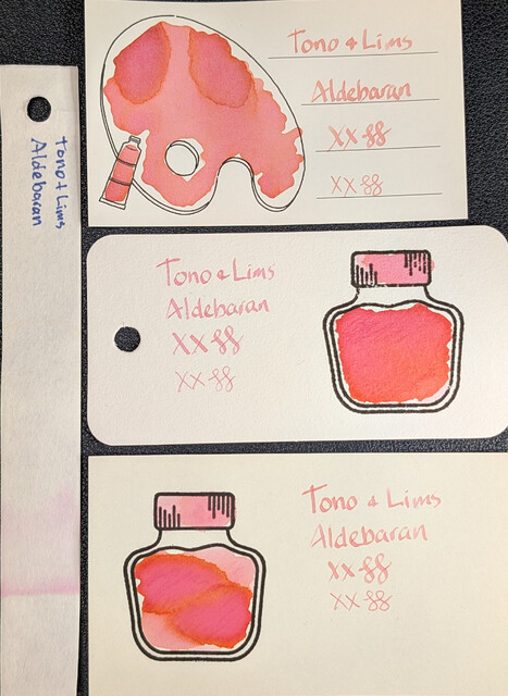 Same as the first photo but under UV light.  The Iroful card itself is glowing dark blue. Text is glowing orange. The swatch is a mix of orange shades and magenta, with some green around the edges.  The col-o-ring card itself is glowing bright light blue. The text is dark blue, while the swatch is orange and magenta/pink.  The MD card text is glowing light blue, so it the cap and the upper right/lower left areas of the swatch The main area of the swatch is glowing magenta outlined in orange.  The chromatography strip has a large area of glowing blue beyond what was visible in visible light, followed by a small area of darker blue/indigo, then a slight halo of green at the edge.