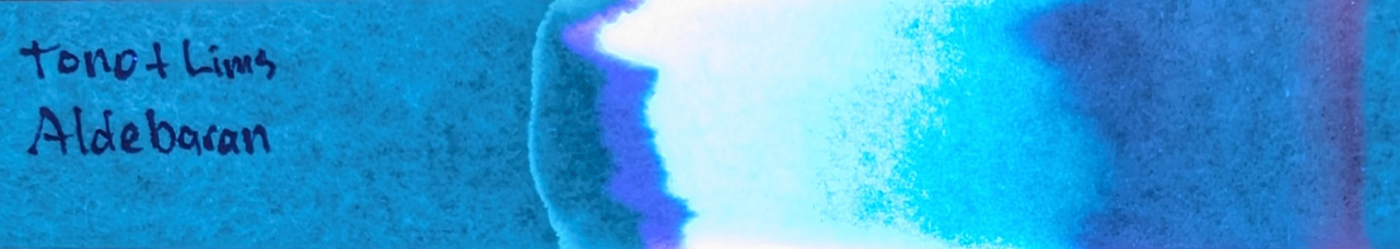 Photo of chromatography paper under UV light.