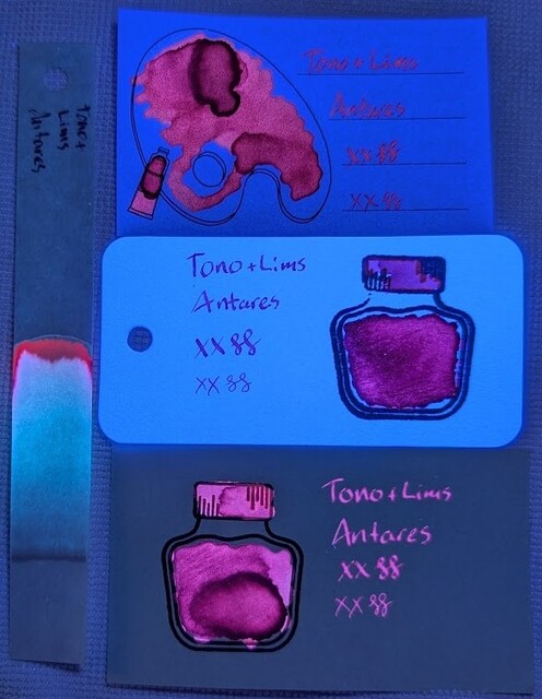 Same as the last photo, but under UV light:  Iroful card: Paper itself is glowing dark blue. Swatch is glowing mostly red, some darker areas. Text is glowing red, but not brightly, and is difficult to read.  Col-o-ring card: Paper is glowing bright blue. Swatch is glowing purple. Text appears purple as well and is readable, but hard to see any glow in the text because of the paper glowing so brightly.  Midori MD card: Paper is barely visible. Swatch is glowing extremely bright pink in some areas, purple in darker areas. Text is glowing extremely bright pink.  Chromatography starts invisible, then glows blue for most of it and then ends in glowing magenta.