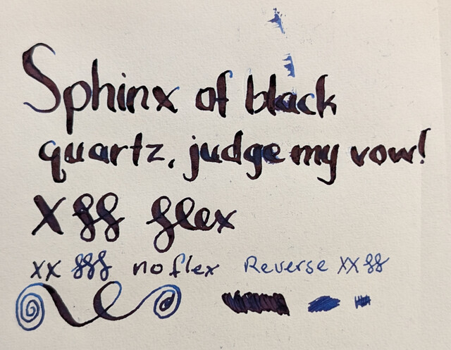 Top-down photo of ink writing and scribbles on Midori MD paper. The ink is a dark blue with dark red sheen.  At the top large words were made with a flex nib and reads "Sphinx of black quartz, judge my vow!" followed by an "X" and curlicues and then the word "flex" in cursive.  Under that is "XX" and three curlicues in a much narrower line that says "no flex".  Next to that is one that says "Reverse" then "XX" and two curlicues, this appears much lighter blue.  Under that are a large looping line and three different scribble puddles (flex, no flex, and reverse)
