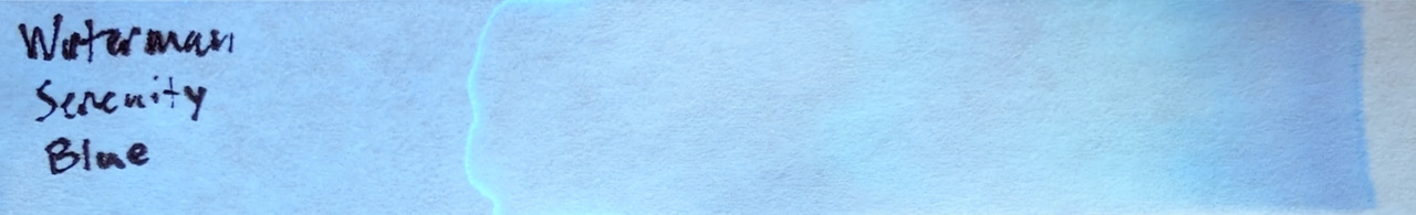 Photo of chromatography paper under UV light.